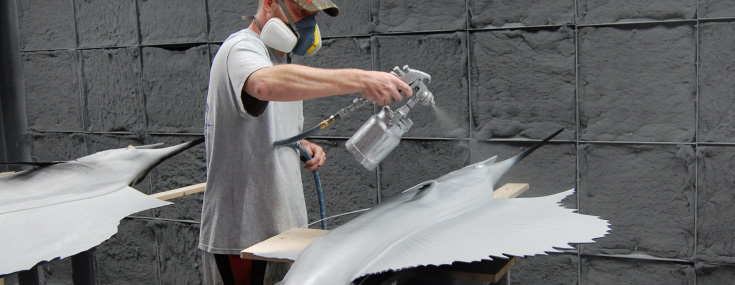 Airbrush artist with Sailfishmount Airbrush artist painting Sailfishmount